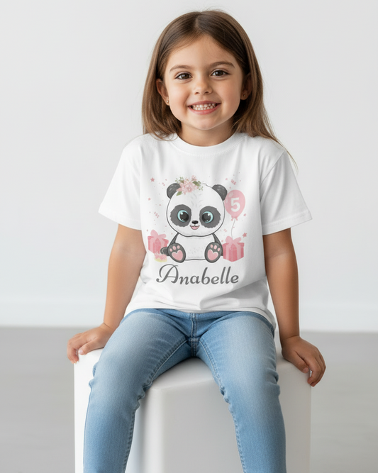 Girl wearing personalised floral panda 5th birthday t-shirt with name Anabelle, white kids birthday shirt studio model front view