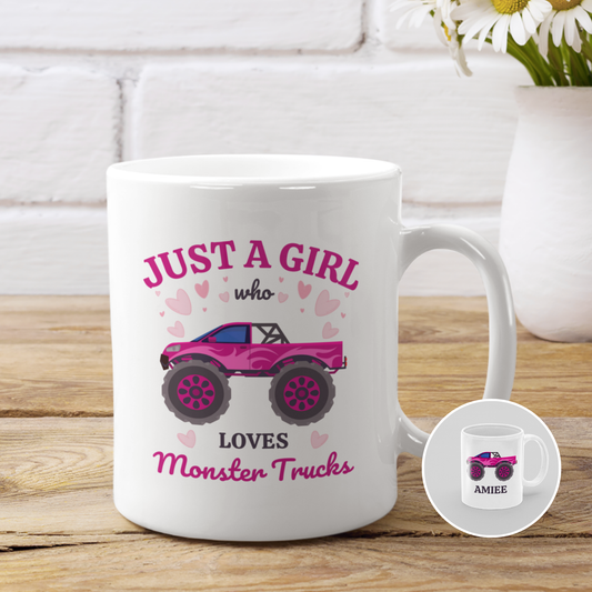 A white ceramic mug with pink and black monster truck design and the text 'Just a girl who loves Monster Trucks'.