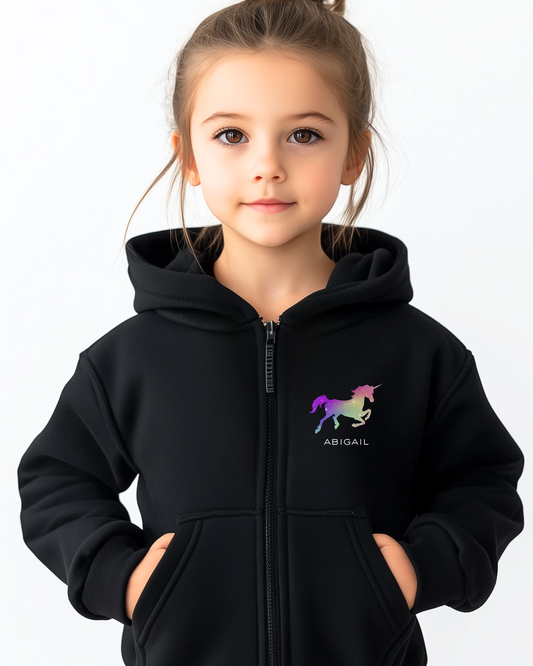 Child wearing a black hoodie with a unicorn logo and name on a white background