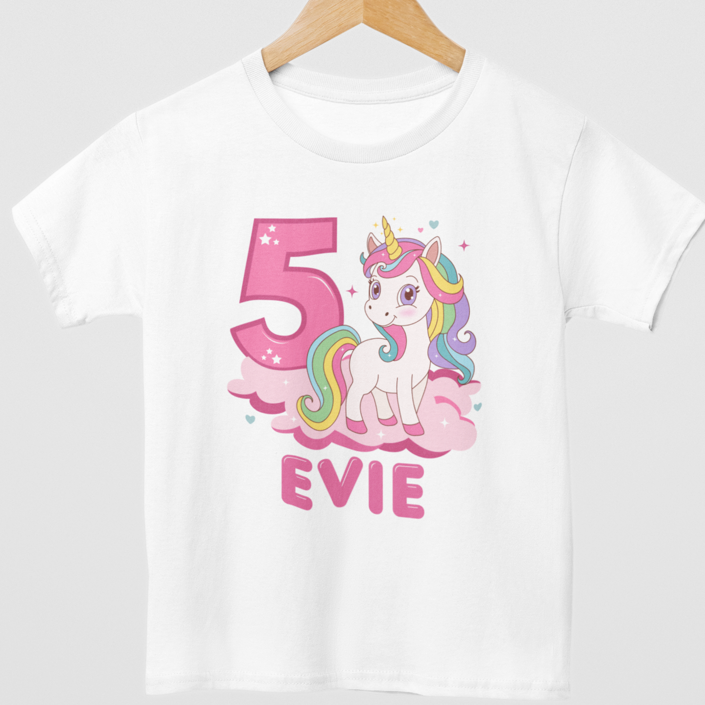 Girls personalised 5th birthday unicorn t-shirt Evie, white kids unicorn birthday shirt with pink number and rainbow unicorn design on hanger