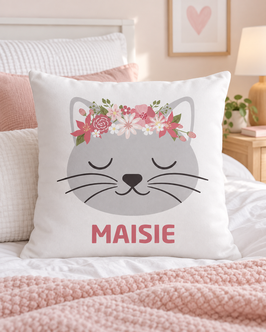Personalised floral cat cushion cover with the name Maisie displayed on a little girl’s bed