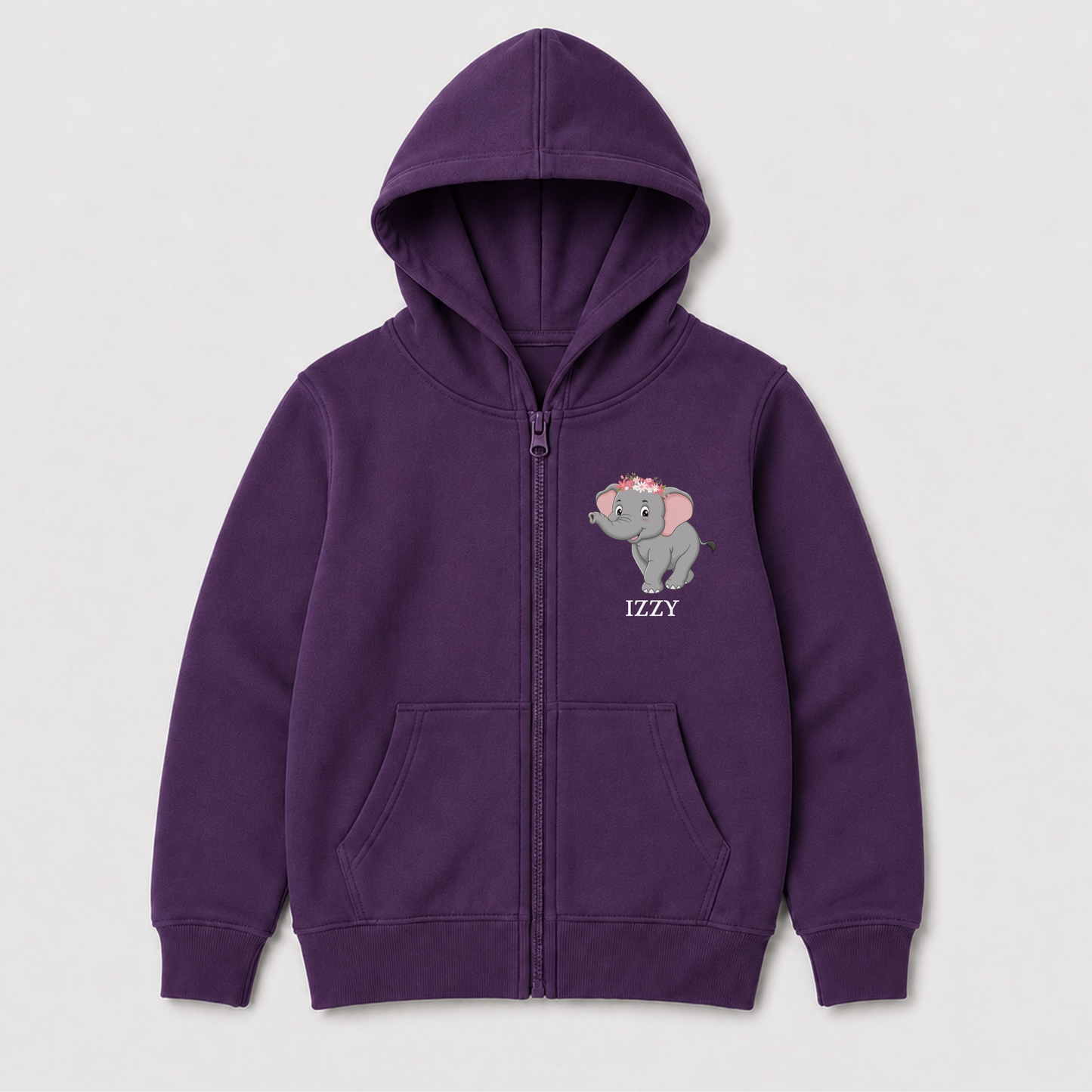 A girls purple zip-up hoodie with a cute elephant and flowers graphic and the name 'Izzy' printed in white on the left chest, flat lay on a light grey background.
