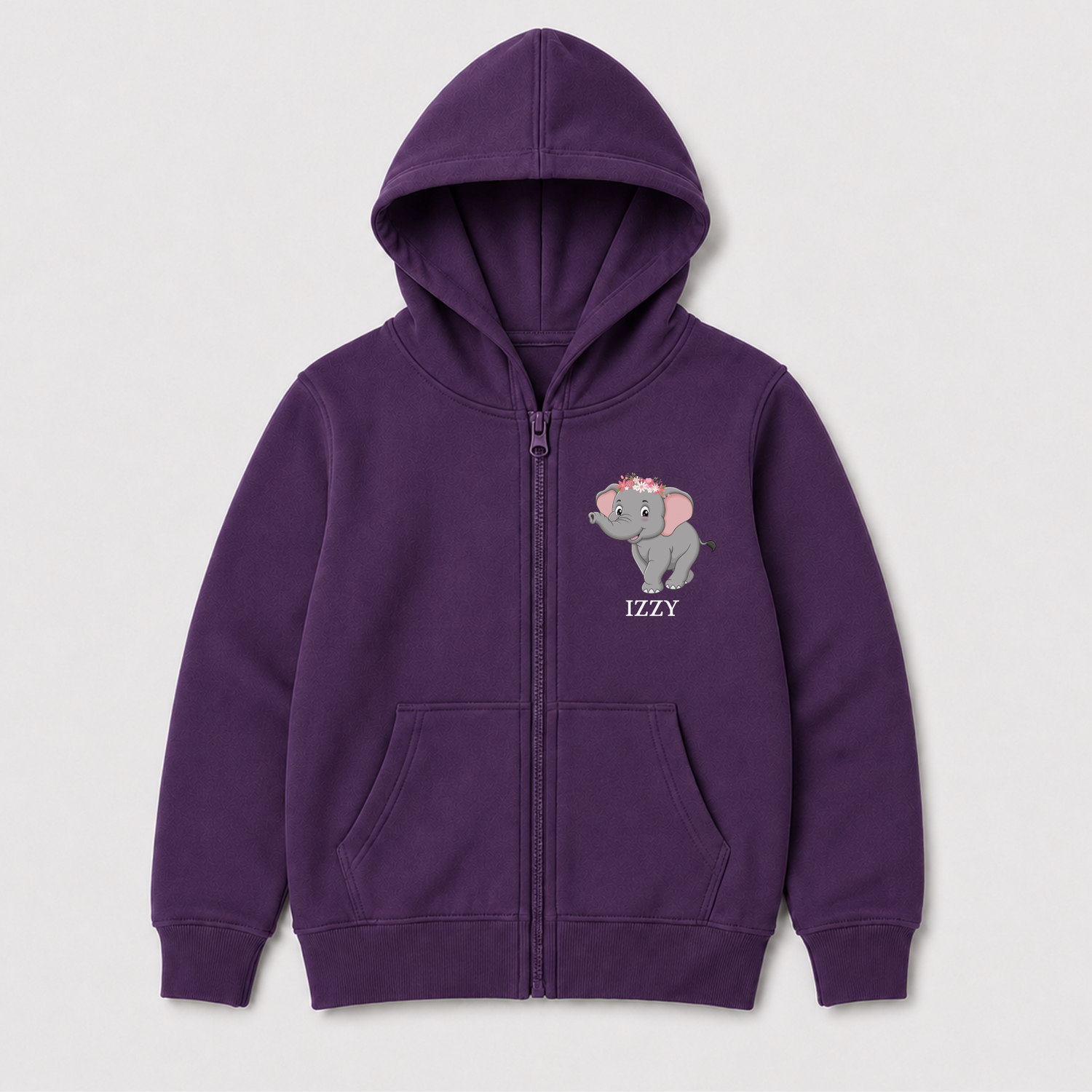 A girls purple zip-up hoodie with a cute elephant and flowers graphic and the name 'Izzy' printed in white on the left chest, flat lay on a light grey background.