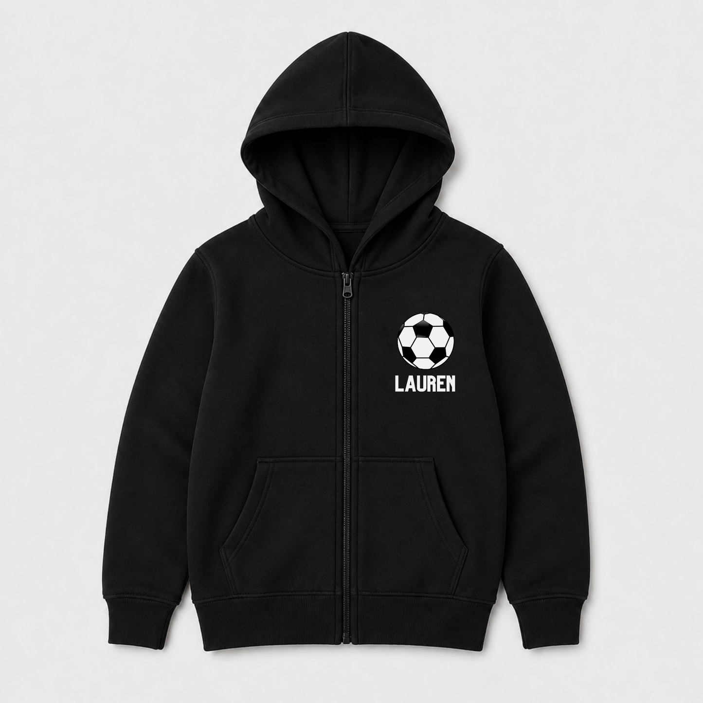 Girls black zip-up hoodie with a white soccer ball graphic and the name 'LAUREN' printed on the left chest, displayed on a light grey background.
