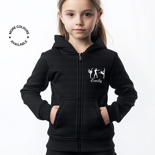 Girl wearing a black zip hoodie with a three gymnast silhouettes striking poses with a personalised name underneath