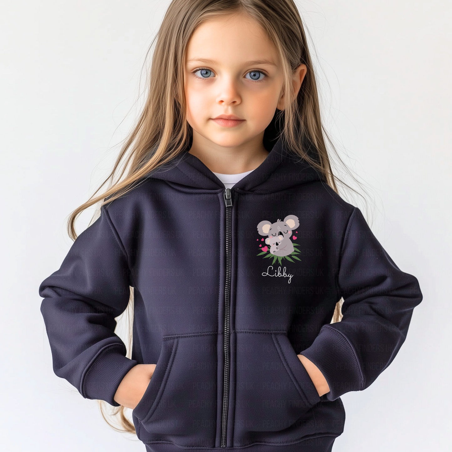 A young girl wearing a navy blue full zip hoodie with a cute koala design printed on the front left-hand side.