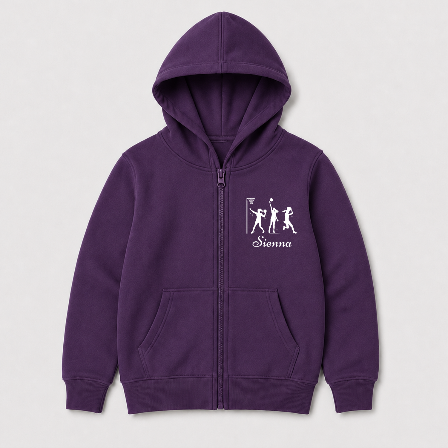 Purple girls’ netball hoodie laid flat, showing the full zip, front pockets and personalised white chest print.