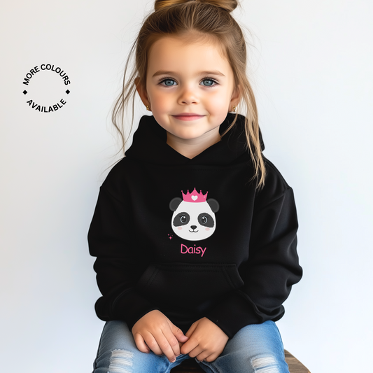 A girl wearing a black hoodie with a personalized name 'Daisy' printed on the front, featuring an adorable panda head wearing a pink crown.