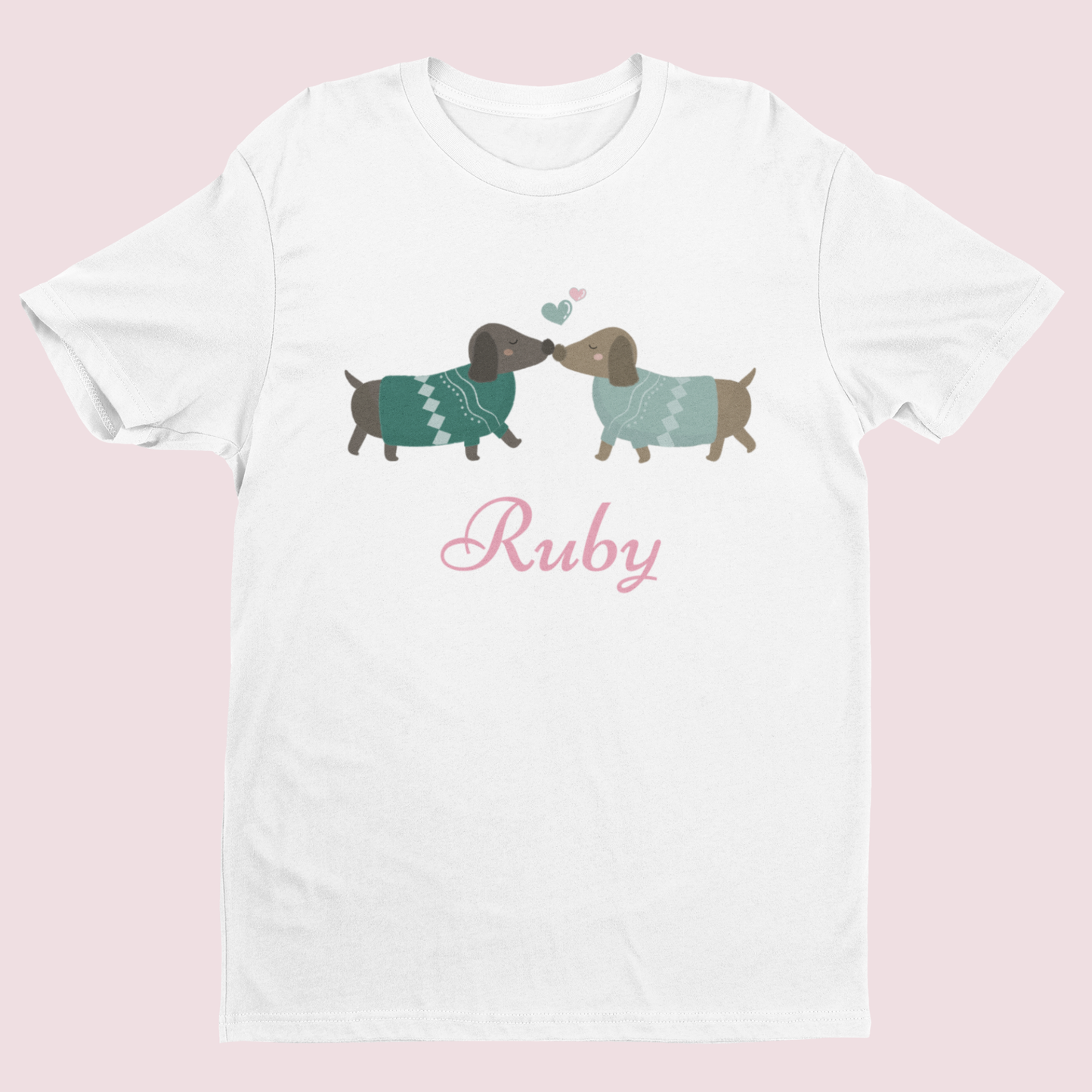 Kids white personalised dachshund T-shirt with Ruby name and cute sausage dog graphic on pink background