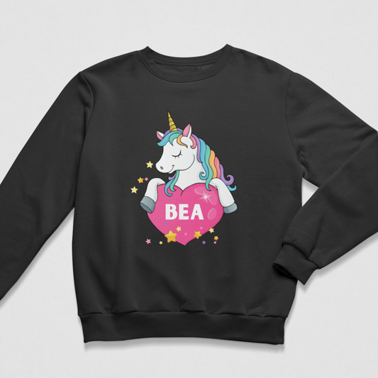 Girls’ black personalised sweatshirt featuring a rainbow-maned unicorn over a pink heart with the name Bea and colourful stars.
