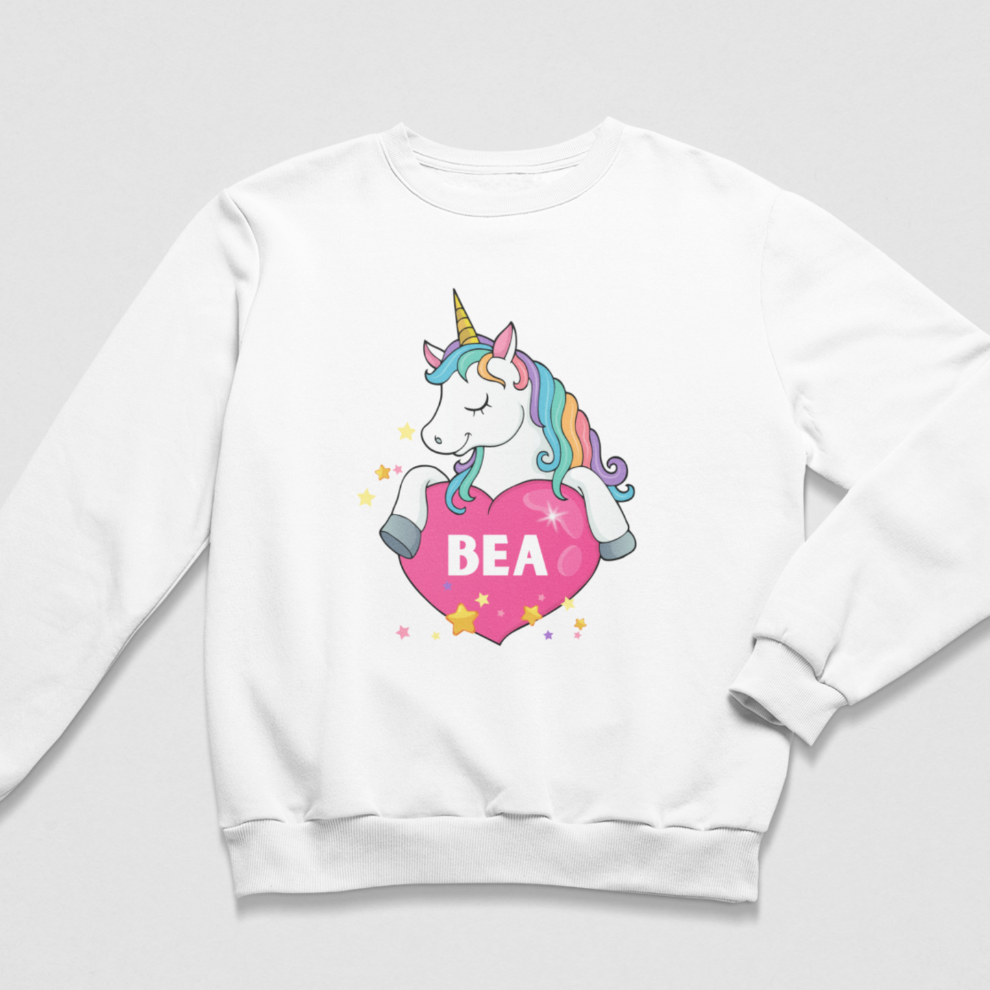 Girls’ white personalised sweatshirt with a colourful unicorn, pink heart, scattered stars and the name Bea.