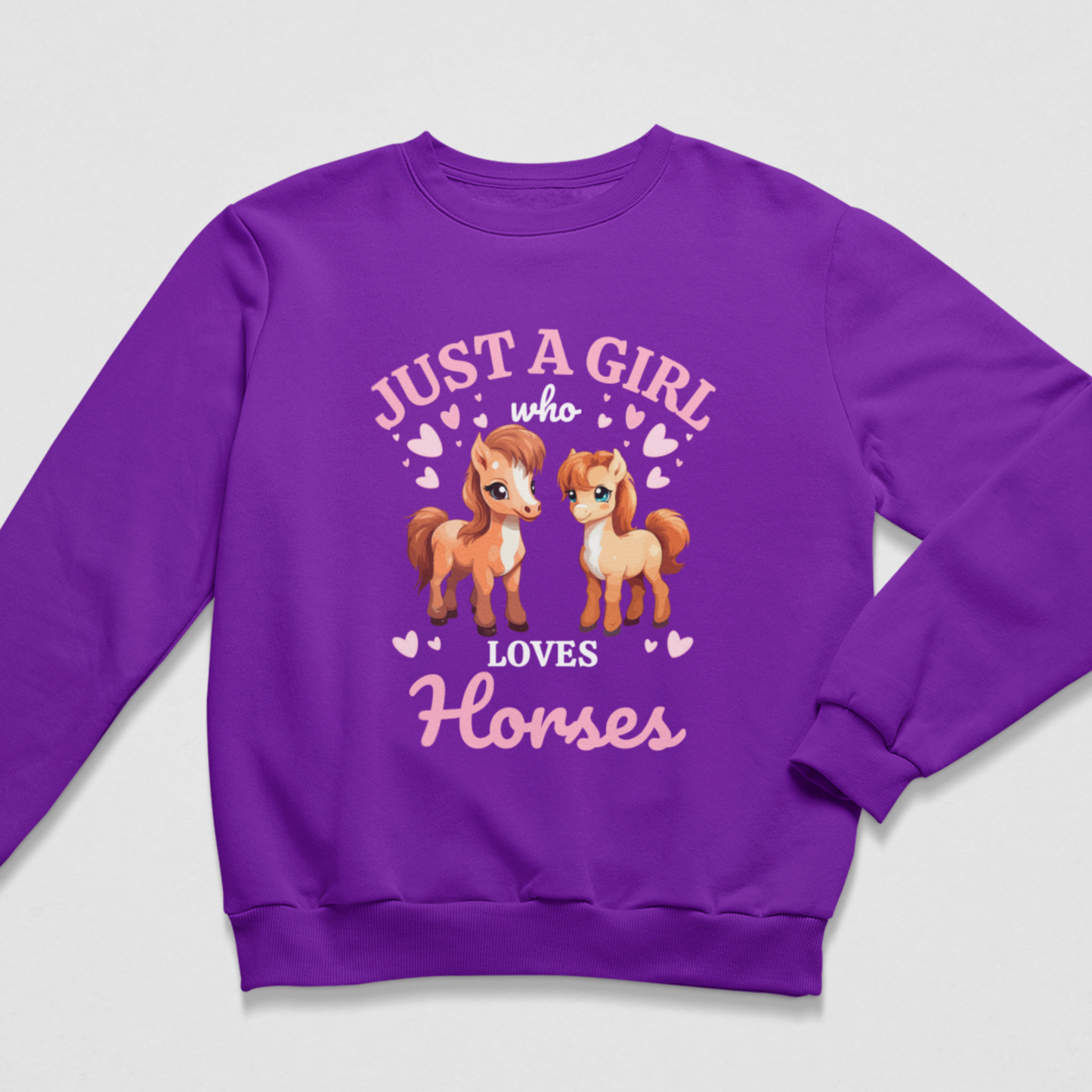 Purple girls’ Just a Girl Who Loves Horses sweatshirt featuring two illustrated ponies surrounded by pink hearts.
