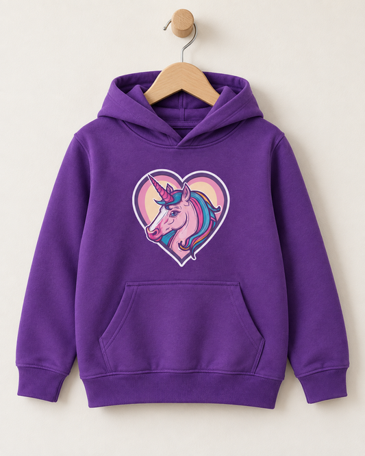 Girls’ purple pullover hoodie on a wooden hanger, featuring a pink unicorn with a colourful mane inside a pink and cream heart.