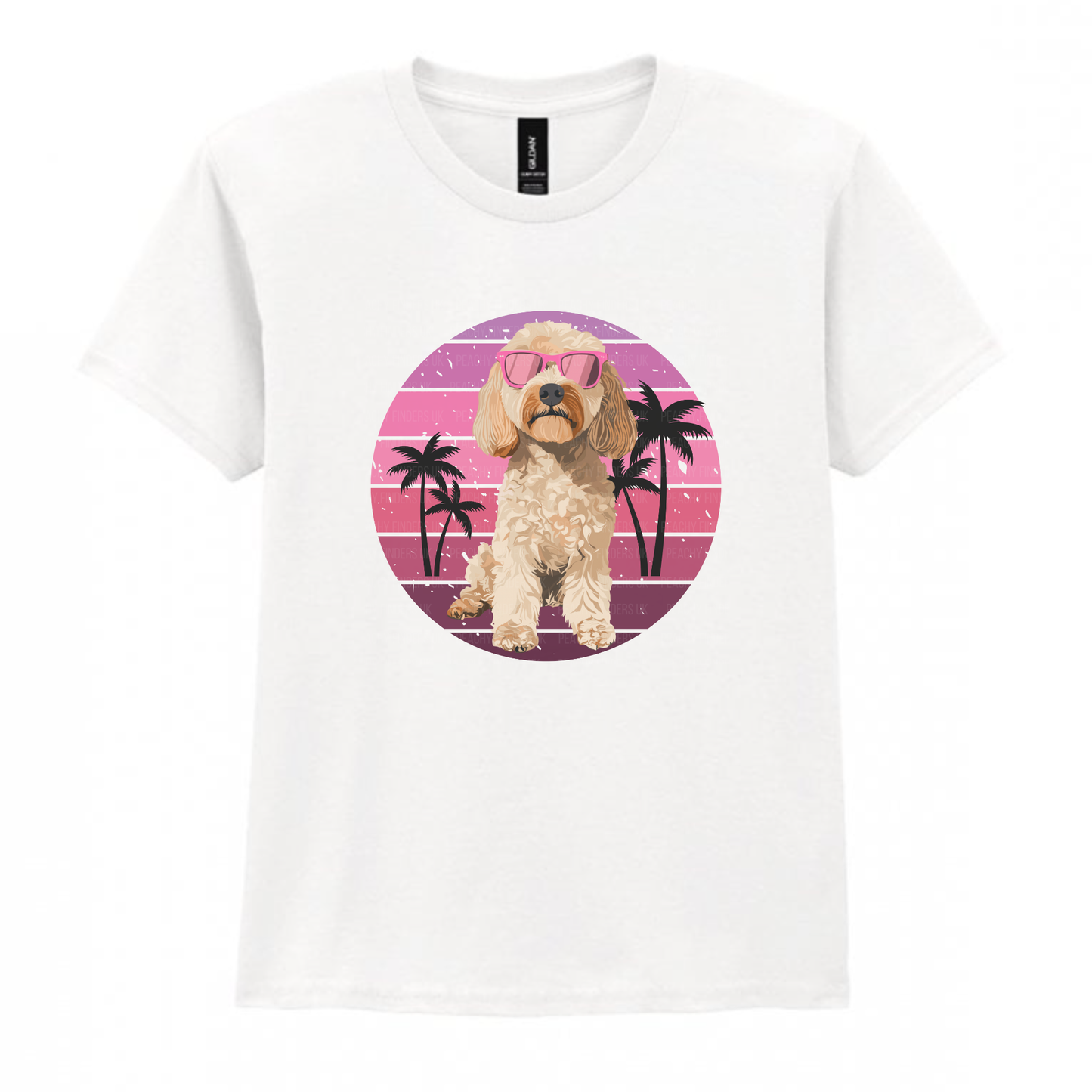 Kids white t-shirt showing cute cockapoo in pink sunglasses with retro sunset background and palm trees.