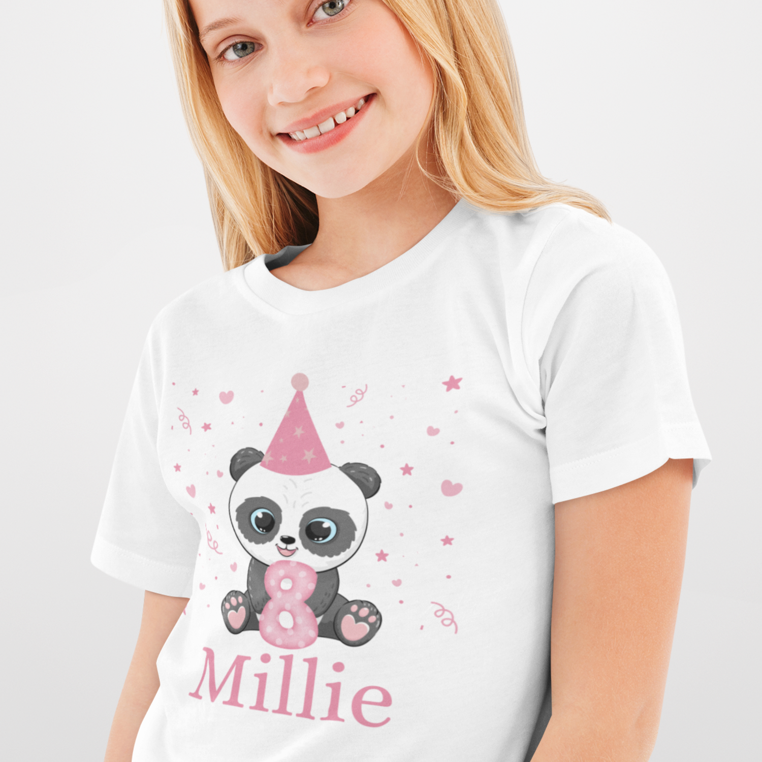 Young girl wearing a white short sleeve birthday t-shirt featuring a cute panda in a pink party hat holding a pink number 8 with stars and hearts around