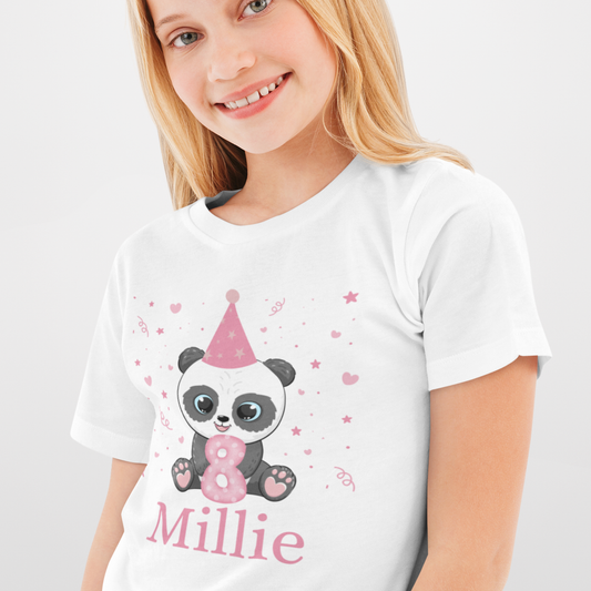 Young girl wearing a white short sleeve birthday t-shirt featuring a cute panda in a pink party hat holding a pink number 8 with stars and hearts around