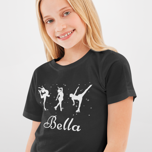 Child wearing a black personalised ice skater t-shirt featuring three white figure skating silhouettes with stars and the name “Bella” printed underneath.