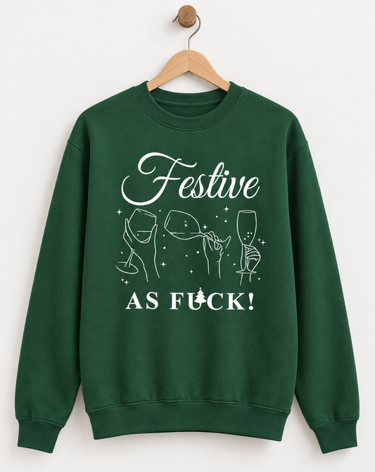 A dark green crewneck sweatshirt with a white graphic print on the front that reads 'Festive AS FUCK!' with line drawings of wine and champagne glasses and stars.