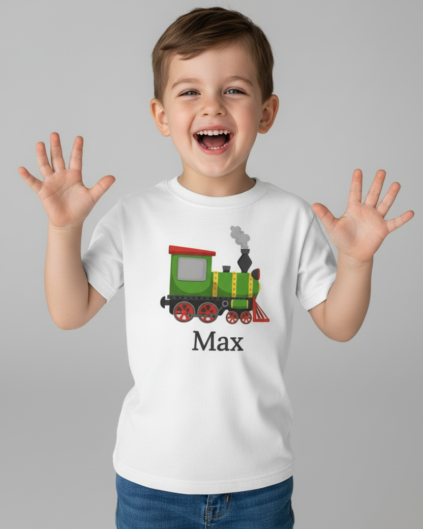 Smiling child modelling custom name steam train white t-shirt, personalised kids train top in soft cotton, studio background