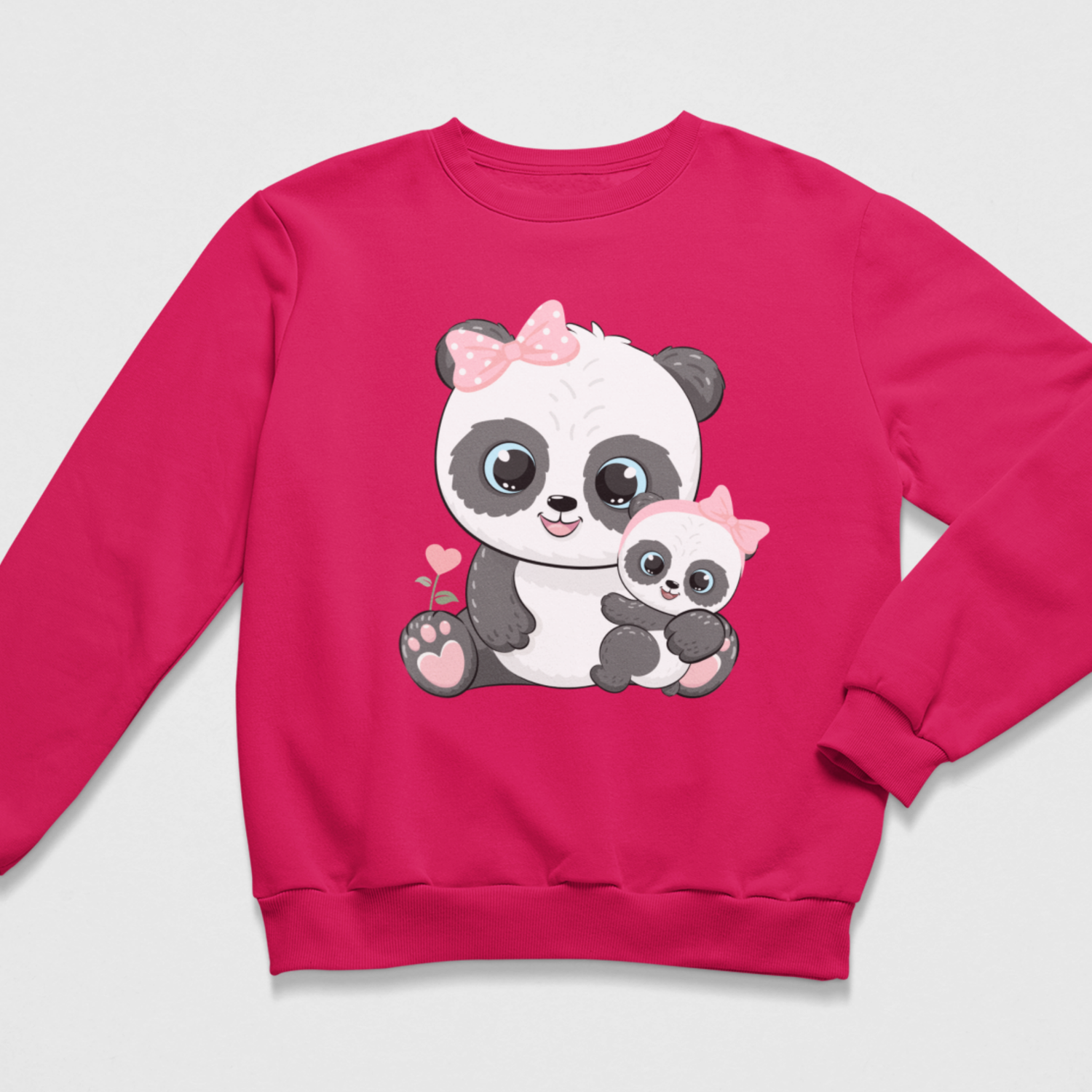 A bright pink crewneck sweatshirt featuring a cute cartoon graphic of a mother panda holding a baby panda, set against a light gray background.