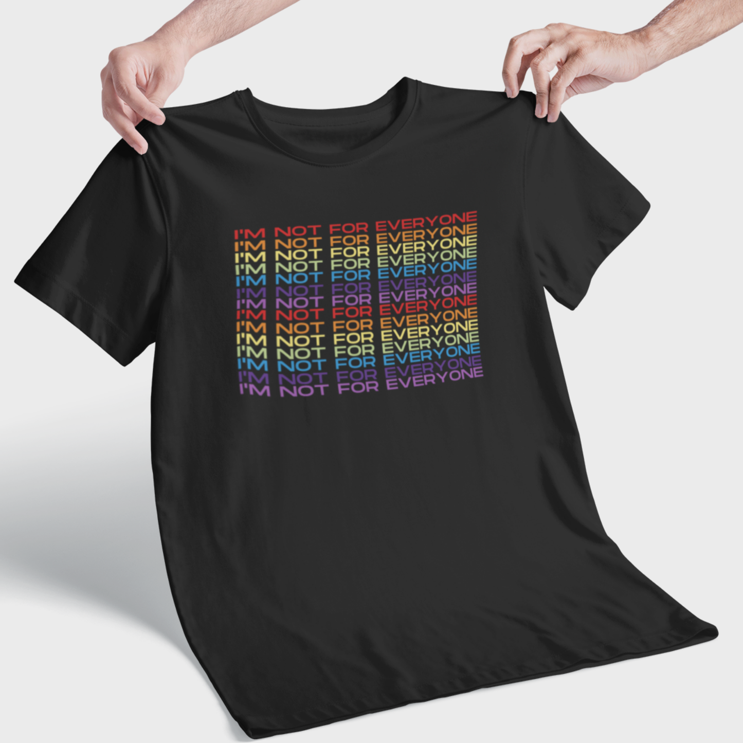 Black unisex t-shirt with rainbow “I’m Not For Everyone” slogan design held up flat