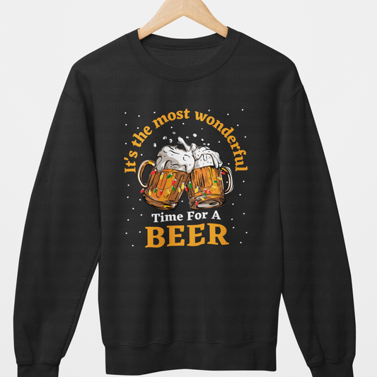Adults Christmas sweatshirt with two clinking beer mugs, Christmas lights, snow, and the phrase "It’s the most wonderful time for a beer."