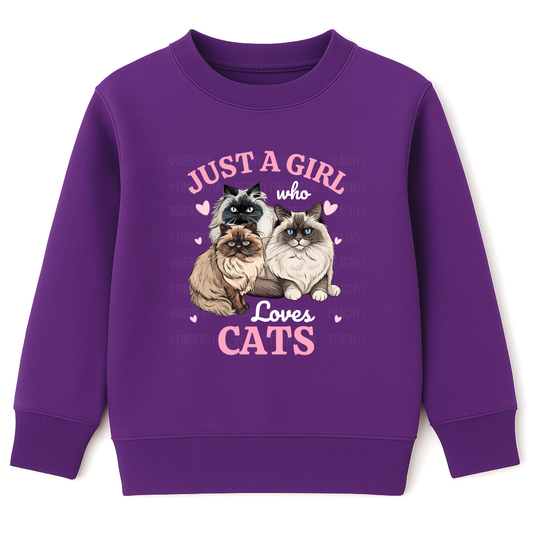 Kids purple sweatshirt printed with three fluffy Ragdoll and Persian cats, pink hearts and the text ‘Just a Girl Who Loves Cats’