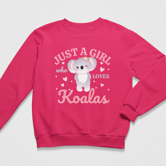 A kids bright pink crewneck sweatshirt featuring a cute cartoon koala graphic with the text 'JUST A GIRL who LOVES Koalas' in pink and white lettering, displayed on a light grey background.