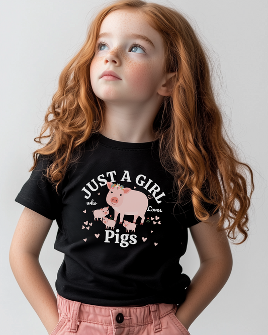 A girl with red hair looking upwards, wearing a black t-shirt with a printed graphic of a mother pig and piglets, and the text 'Just a girl who loves pigs'.