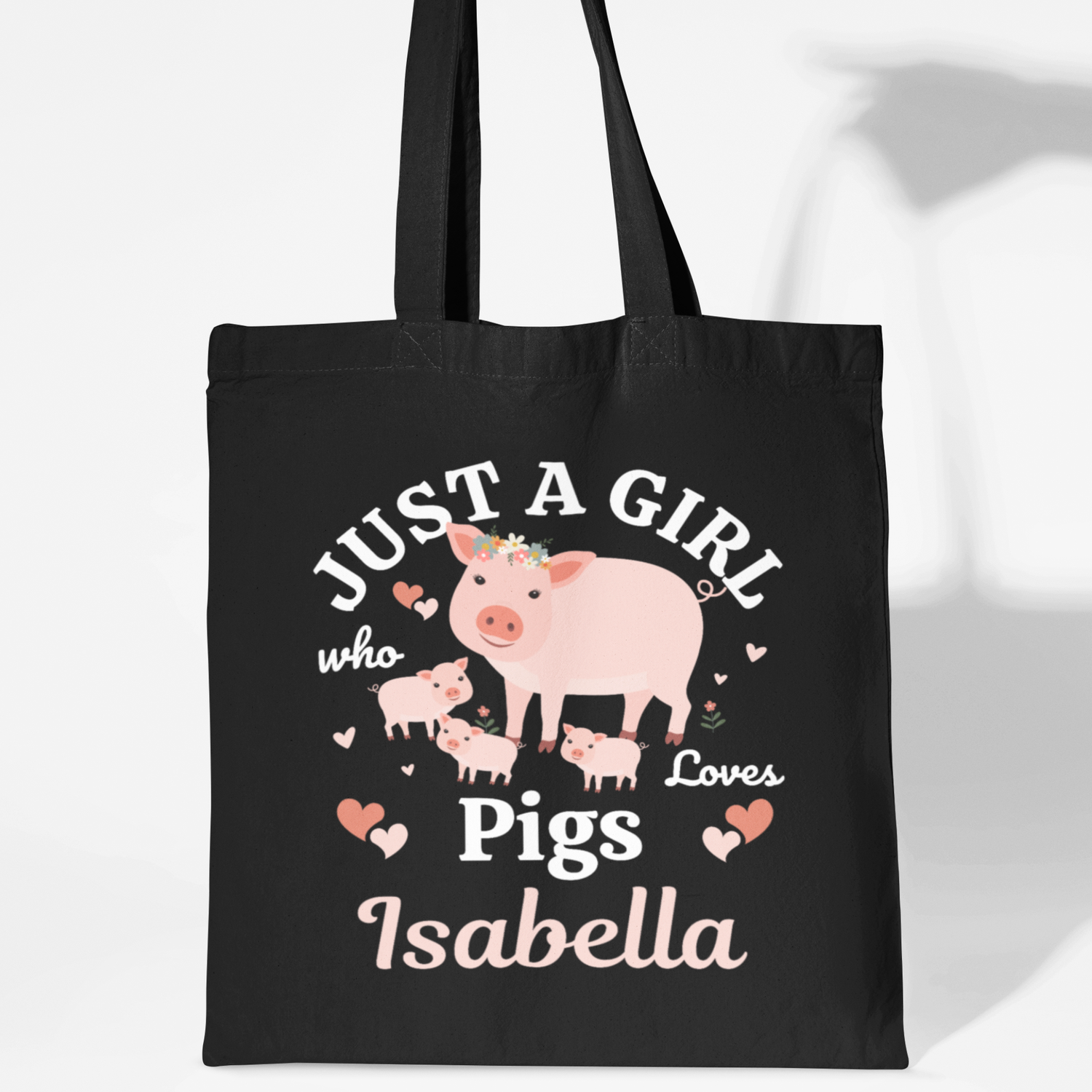 Black cotton tote bag with a “Just a Girl Who Loves Pigs” design, showing a mum pig with piglets and a personalised name underneath.