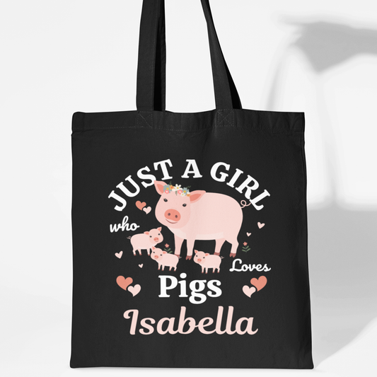 Black cotton tote bag with a “Just a Girl Who Loves Pigs” design, showing a mum pig with piglets and a personalised name underneath.