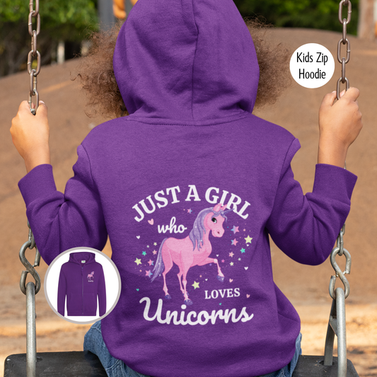 A little girl wearing a purple zip-up hoodie, sits on a swing with their back to the viewer. The hoodie features a graphic that reads "JUST A GIRL who LOVES Unicorns" with a pink unicorn and colourful stars.
