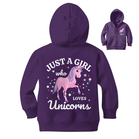 A purple zipped hoodie is displayed from the back, featuring the text "JUST A GIRL who LOVES Unicorns" in white and pink around a graphic of a pink unicorn with a sparkly horn and colourful stars. An inset shows the front of the hoodie with name.