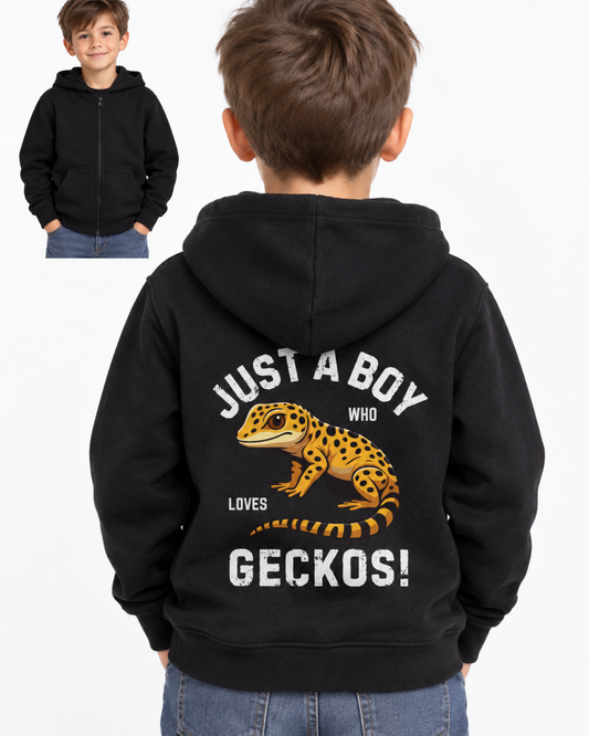 A child shown from the back wearing a black zip-up hoodie with a large gecko graphic and the text 'JUST A BOY WHO LOVES GECKOS!' on the back. A smaller inset at the top left shows the child from the front in the same hoodie against a plain light background.