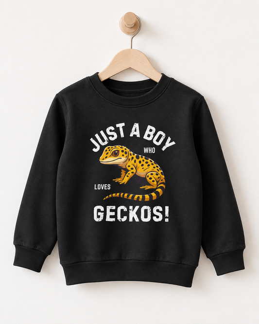 Black crewneck kids sweatshirt on a wooden hanger featuring a yellow leopard gecko and “Just a Boy Who Loves Geckos” front print.