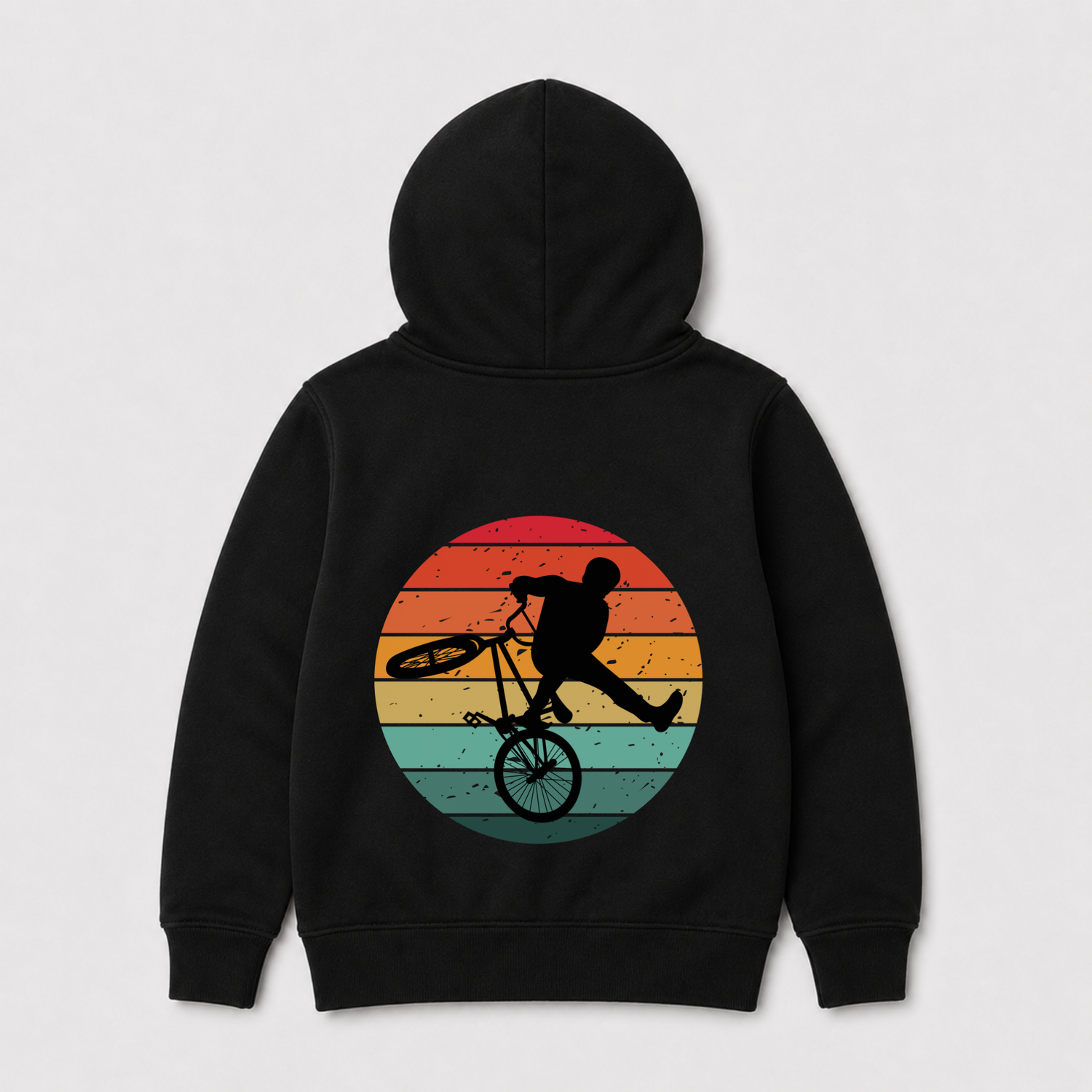A black pullover hoodie shown from the back, featuring a large graphic print of a BMX rider in black silhouette riding in front of a retro circular sunset with orange, yellow, and teal stripes.