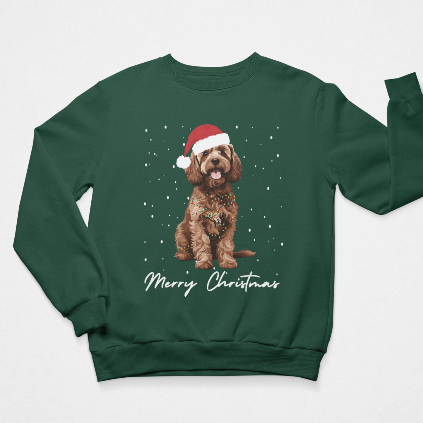 A kids dark green crewneck sweatshirt featuring a graphic of a brown cockapoo dog wearing a red Santa hat, surrounded by white snowflakes, with 'Merry Christmas' written in white script below. The sweatshirt is displayed flat against a light grey background.