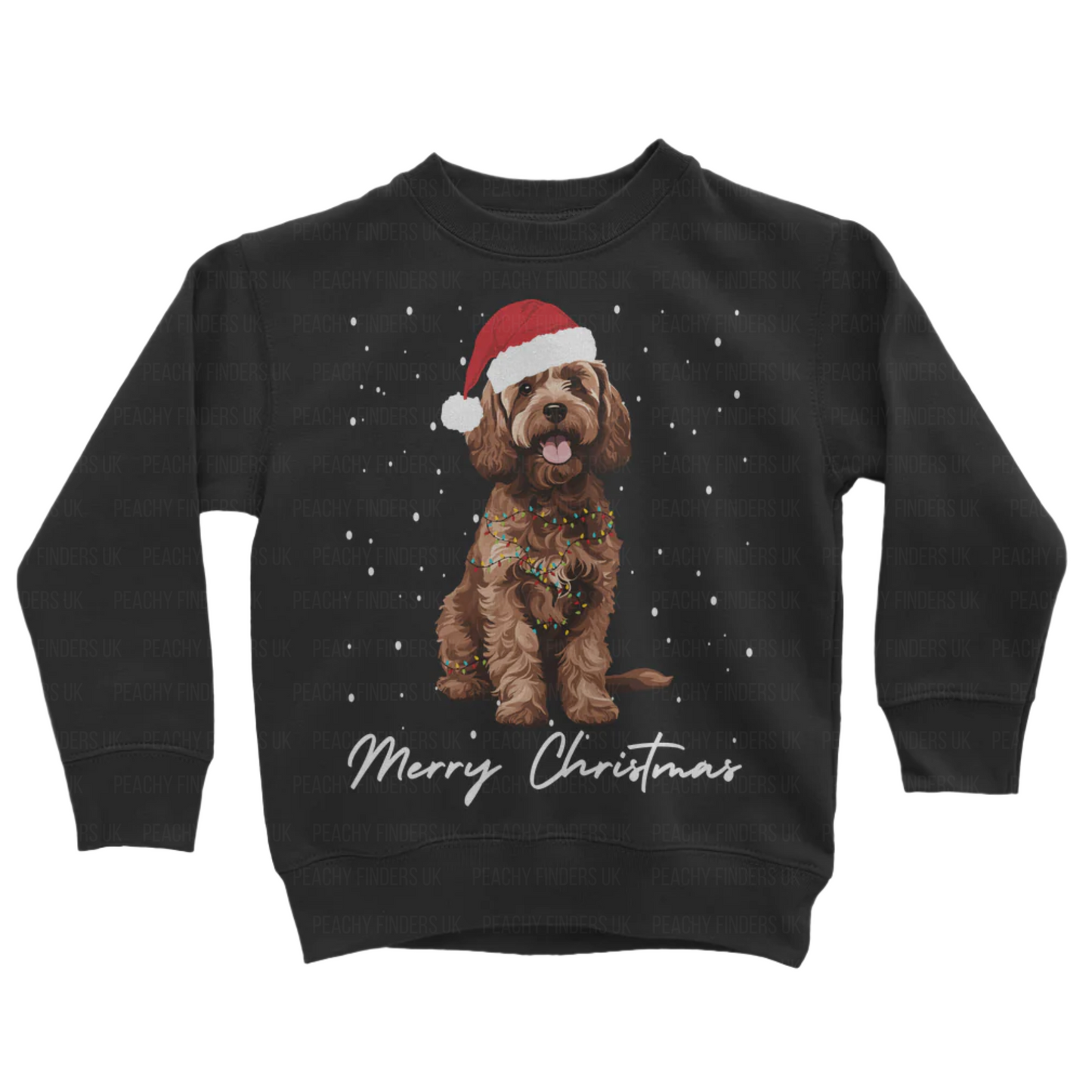 Kids black sweatshirt with a Christmas-themed design of a brown cockapoo wearing a Santa hat, wrapped in fairy lights with falling snow and the text 'Merry Christmas'.