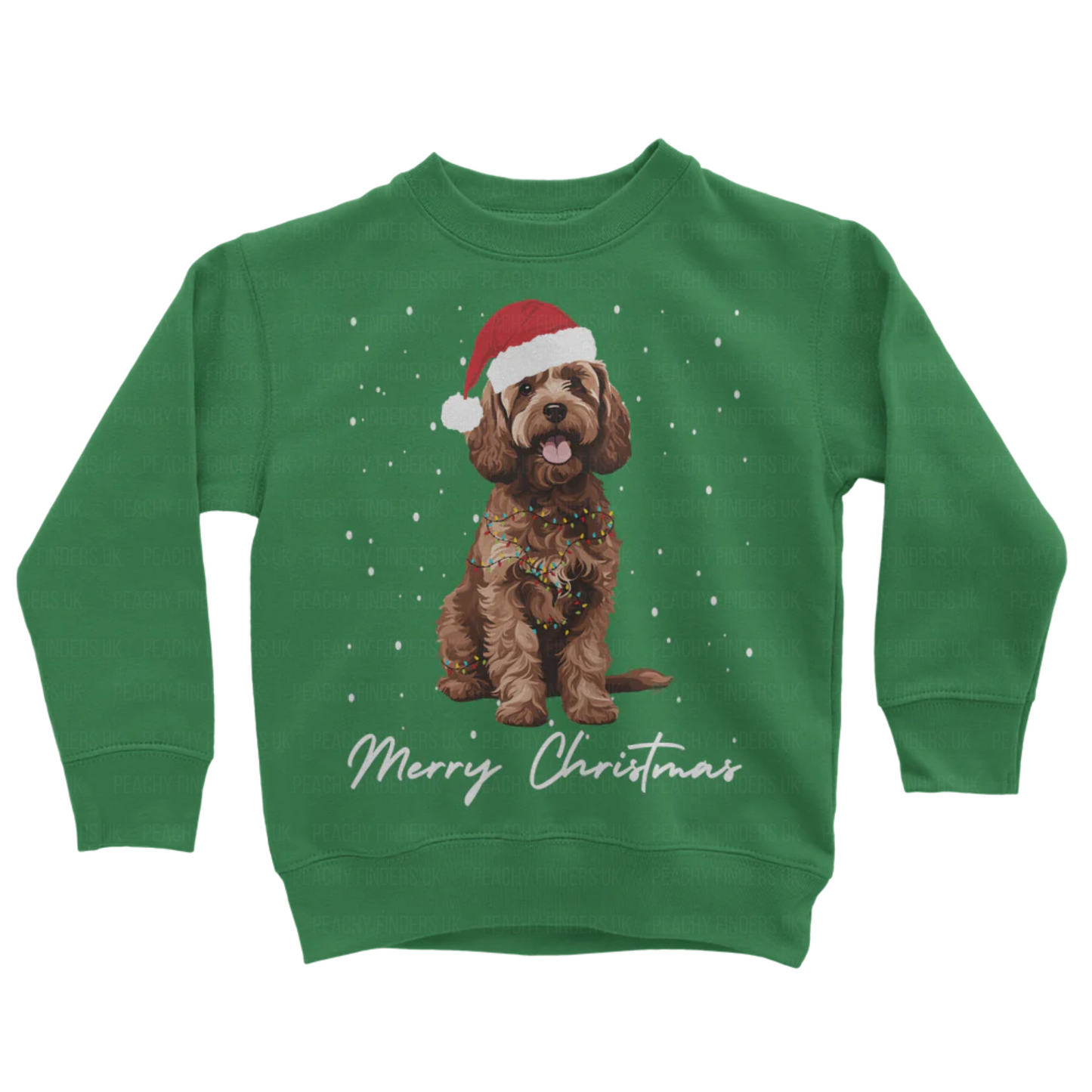 Kids green sweatshirt with a Christmas-themed design of a brown cockapoo wearing a Santa hat, wrapped in fairy lights with falling snow and the text 'Merry Christmas'.