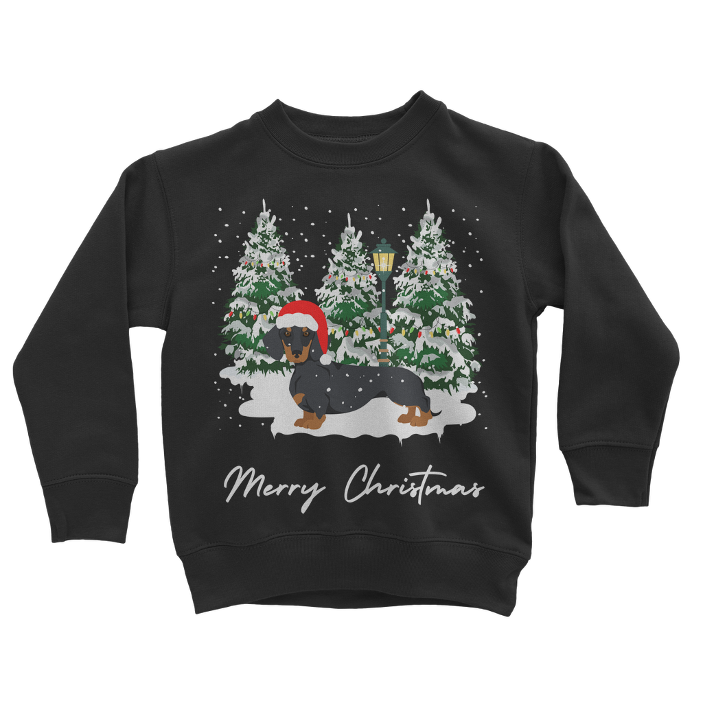 Kids Black Christmas sweatshirt featuring a festive dachshund in a Santa hat, standing in front of snowy Christmas trees with a lamp post.