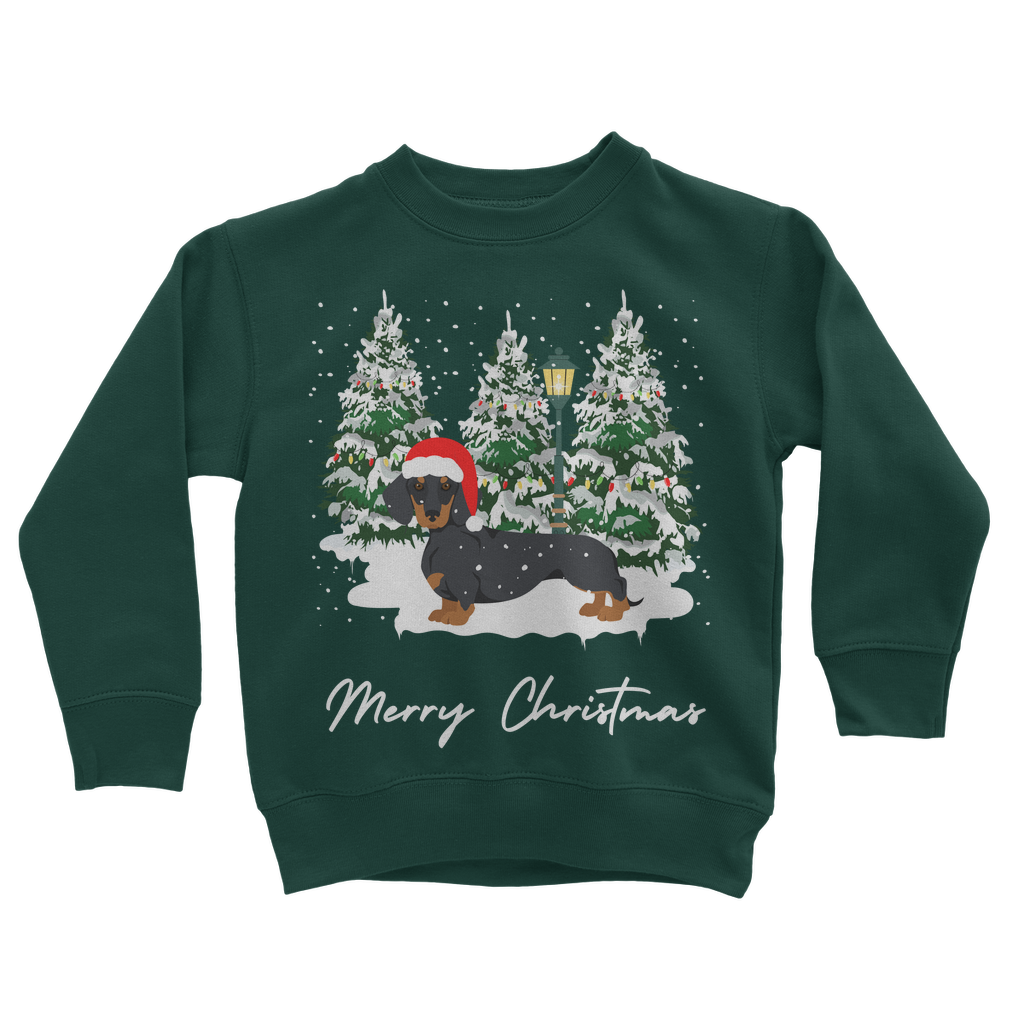 Kids dark green Christmas sweatshirt featuring a festive dachshund in a Santa hat, standing in front of snowy Christmas trees with a lamp post.