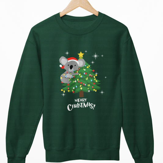 Green sweatshirt with a Christmas design of a koala and tree on a white background