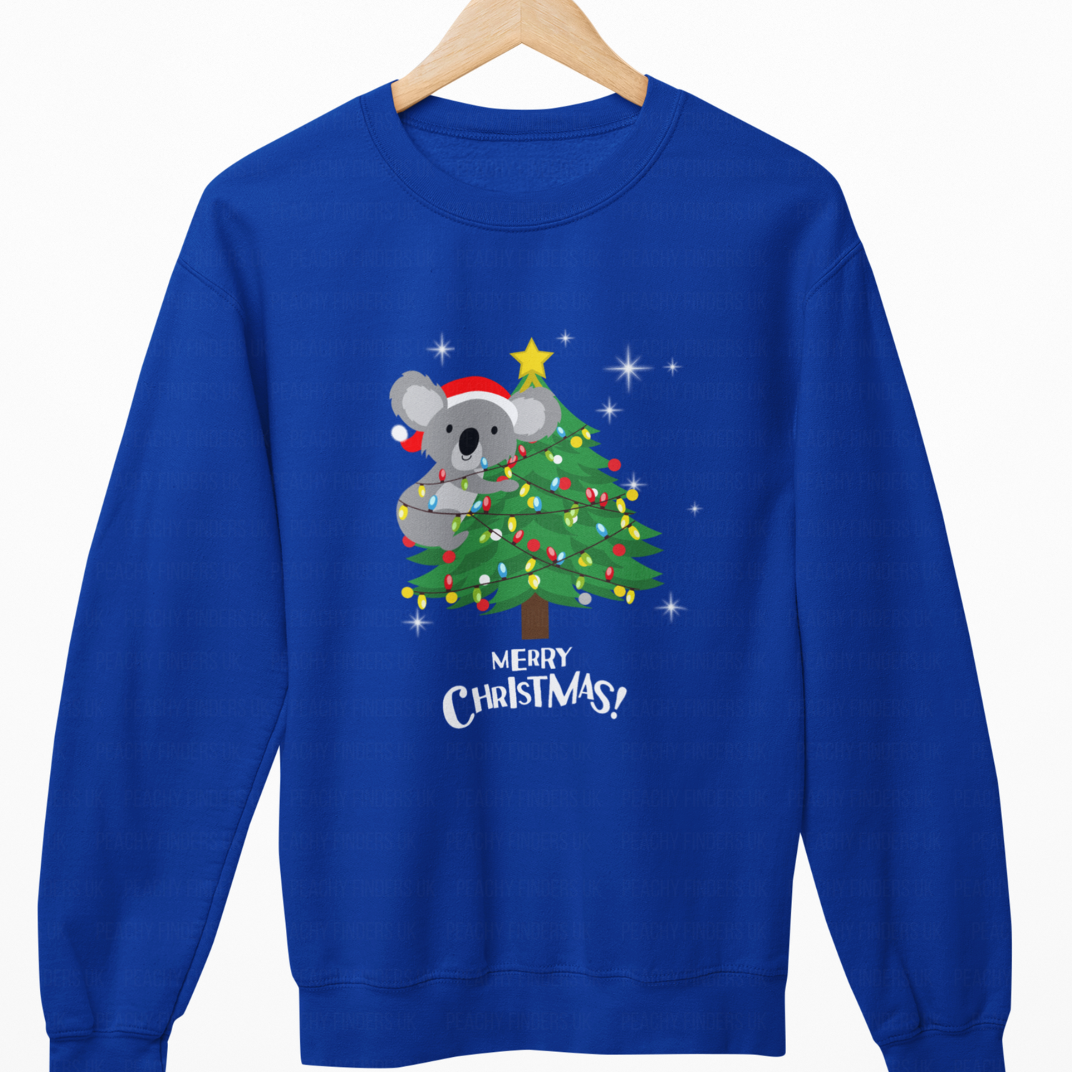 Royal Blue sweatshirt with a Christmas design of a koala and tree on a hanger