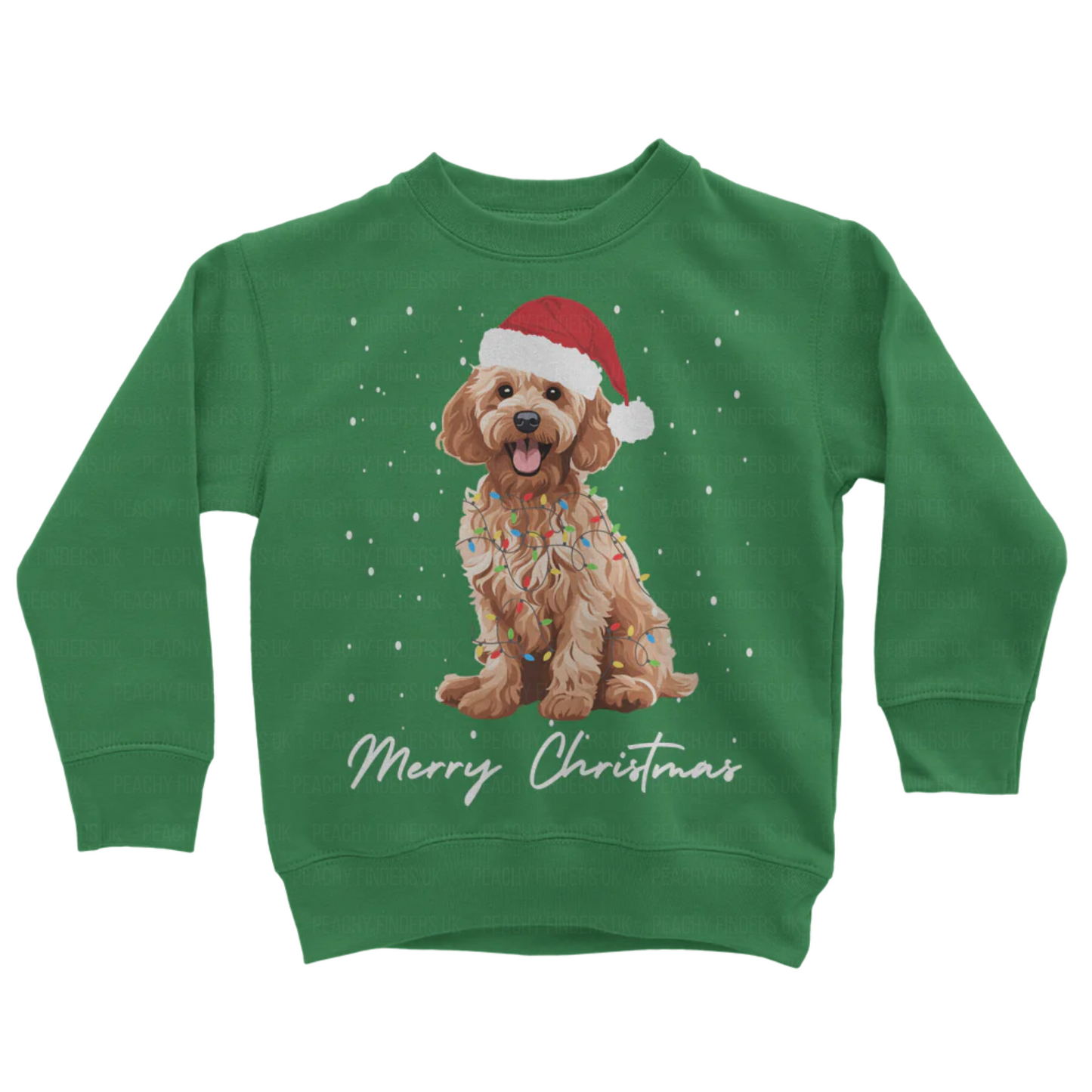 Kids green sweatshirt with a Christmas-themed design of a golden cockapoo wearing a Santa hat, wrapped in fairy lights with falling snow and the text 'Merry Christmas'.