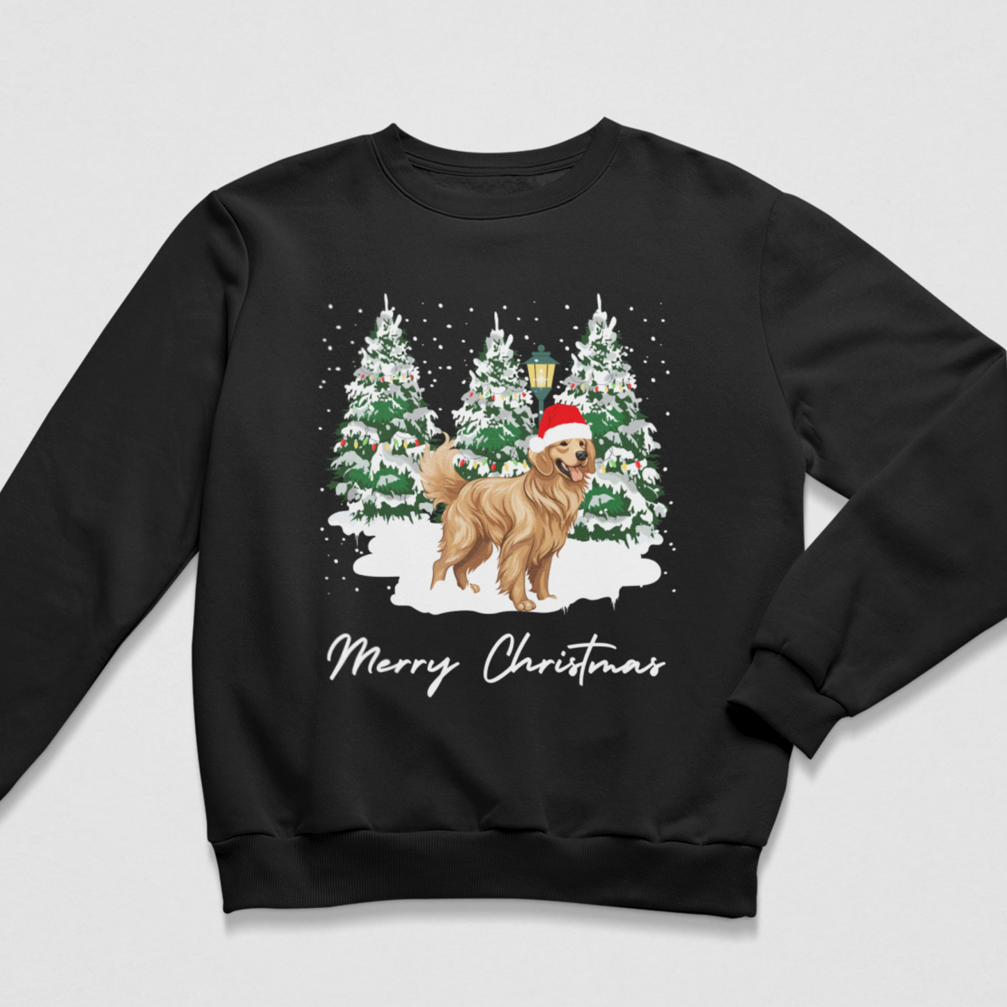 A kids black crewneck sweatshirt featuring a festive Christmas graphic of a golden dog wearing a Santa hat, standing in front of snow-covered pine trees with the text 'Merry Christmas' written below.