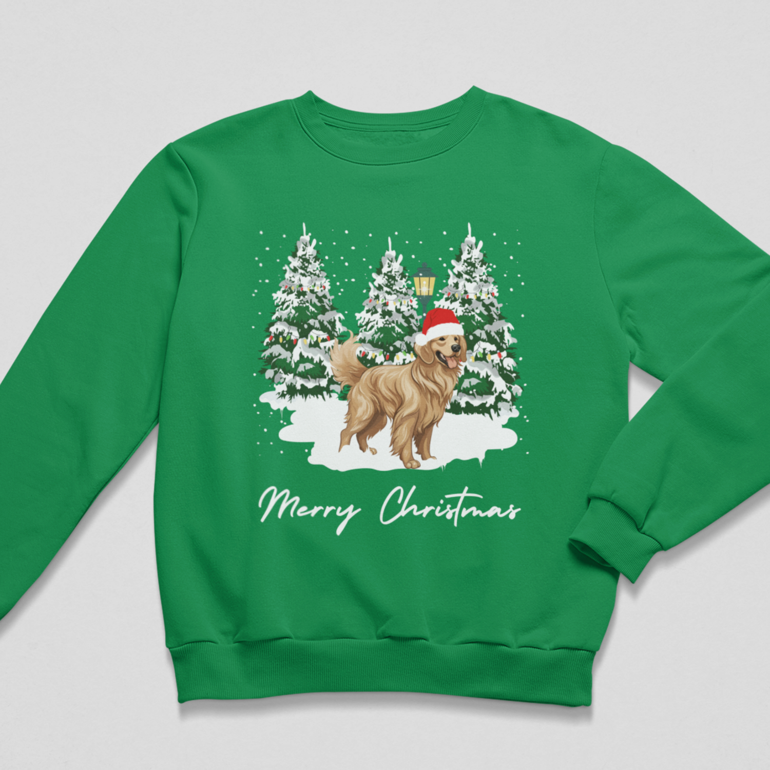 A kids green crewneck sweatshirt featuring a festive Christmas graphic of a golden retriever dog wearing a Santa hat in front of snow-covered trees, with 'Merry Christmas' written below in white script.
