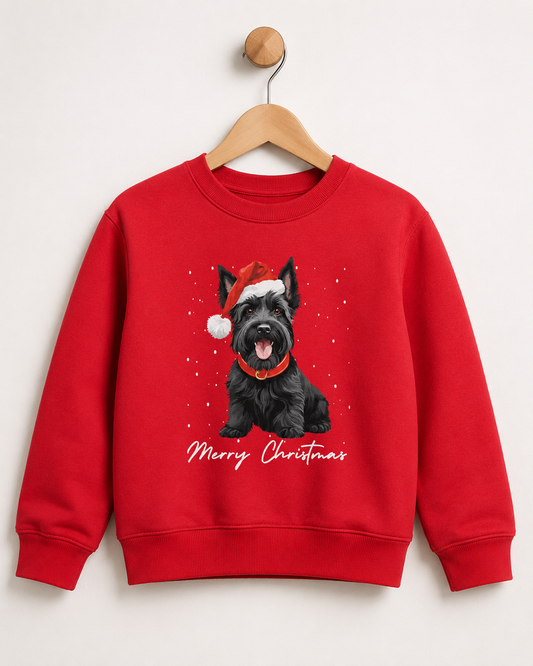 Children's red crewneck sweatshirt hanging on a wooden hanger against a light grey background. The sweatshirt features a graphic of a black Scottish Terrier wearing a Santa hat, with 'Merry Christmas' written in white script below.