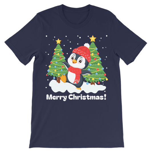 A kids navy blue short-sleeve crewneck t-shirt featuring a festive Christmas graphic of a cartoon penguin wearing a red hat and scarf, standing between two decorated Christmas trees on a snowy ground with the text 'Merry Christmas!' printed below.