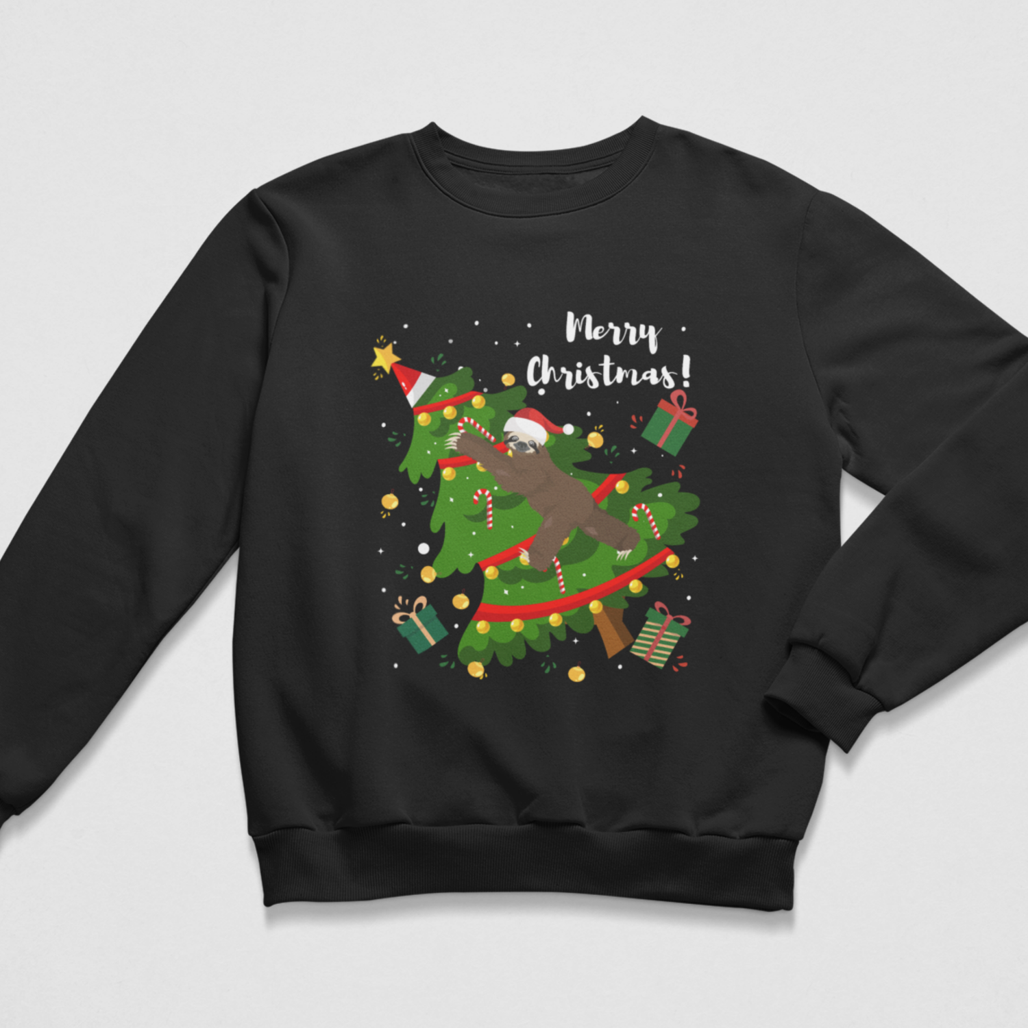 Black kids Christmas jumper featuring a sloth in a Santa hat climbing through a decorated Christmas tree with presents, candy canes and Merry Christmas text