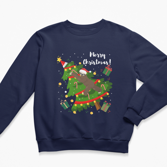 Navy kids Christmas jumper featuring a sloth in a Santa hat climbing through a decorated Christmas tree with presents, candy canes and Merry Christmas text